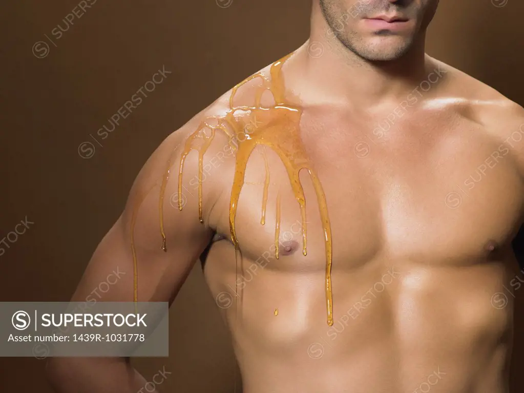 Honey dripping down a mans chest