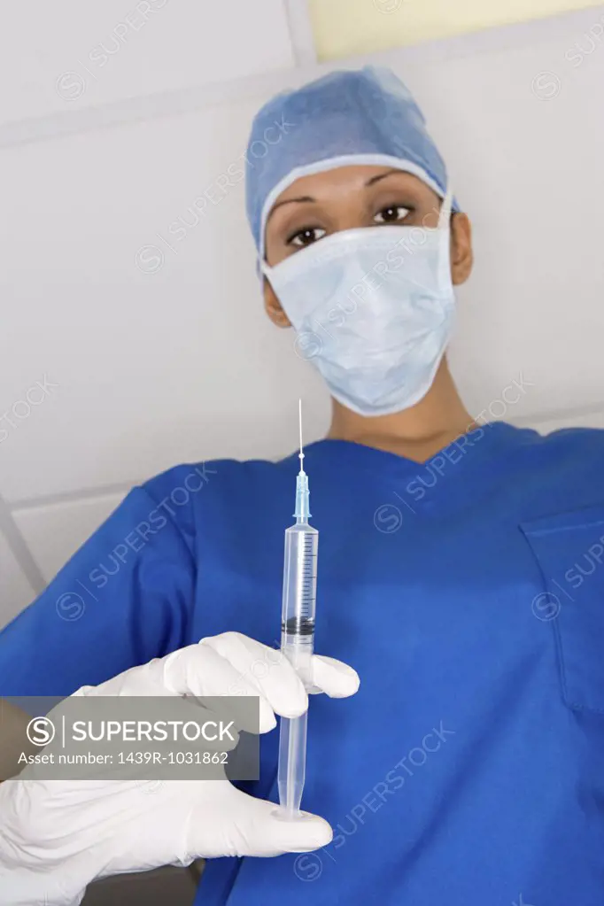 Surgeon with a syringe