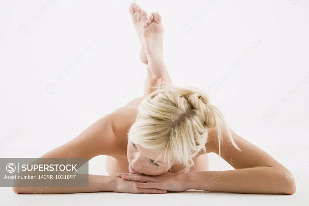 Nude woman lying down