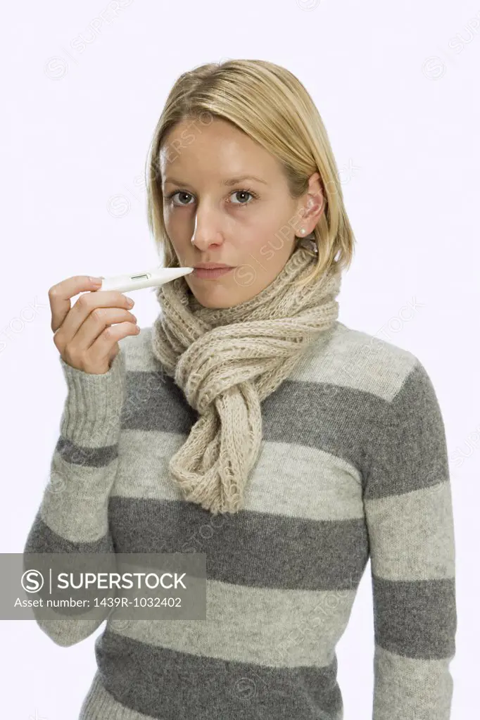 Woman using thermometer