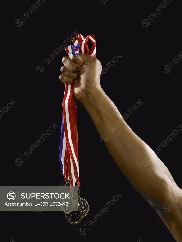 Person holding medals