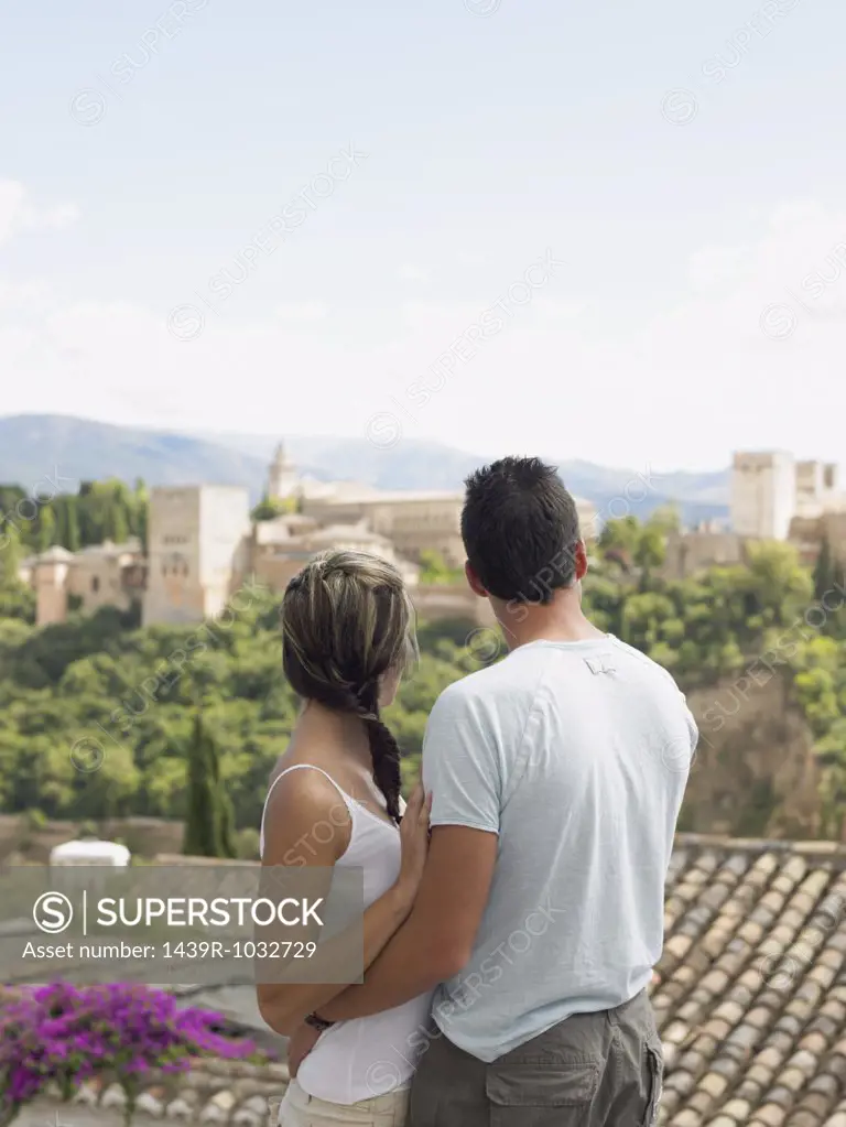 Couple looking at alhambra palace