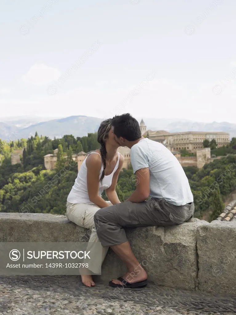 Couple kissing near alhambra