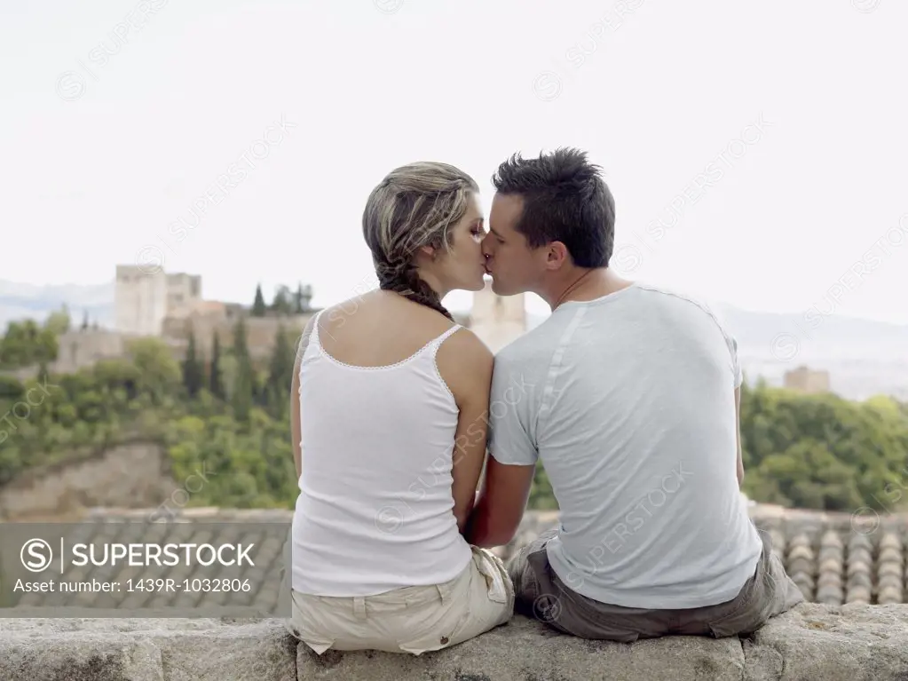Couple kissing near alhambra