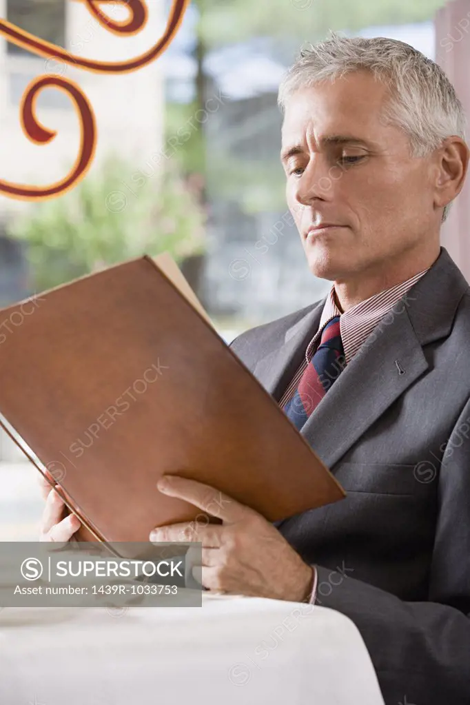 Man looking at a menu