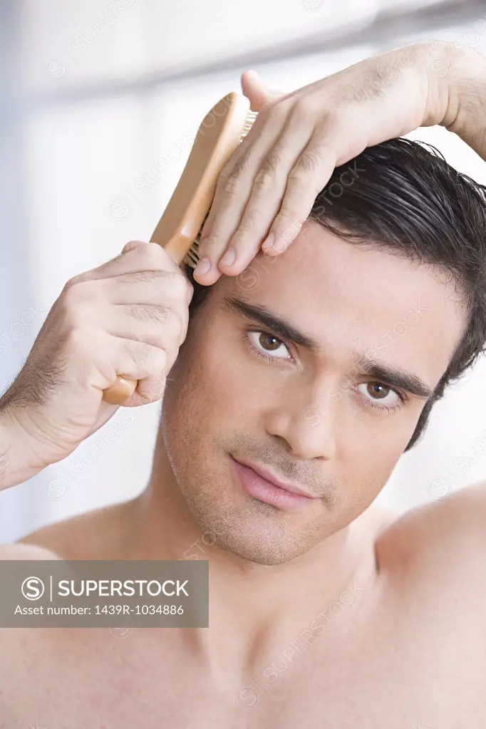 Man combing his hair