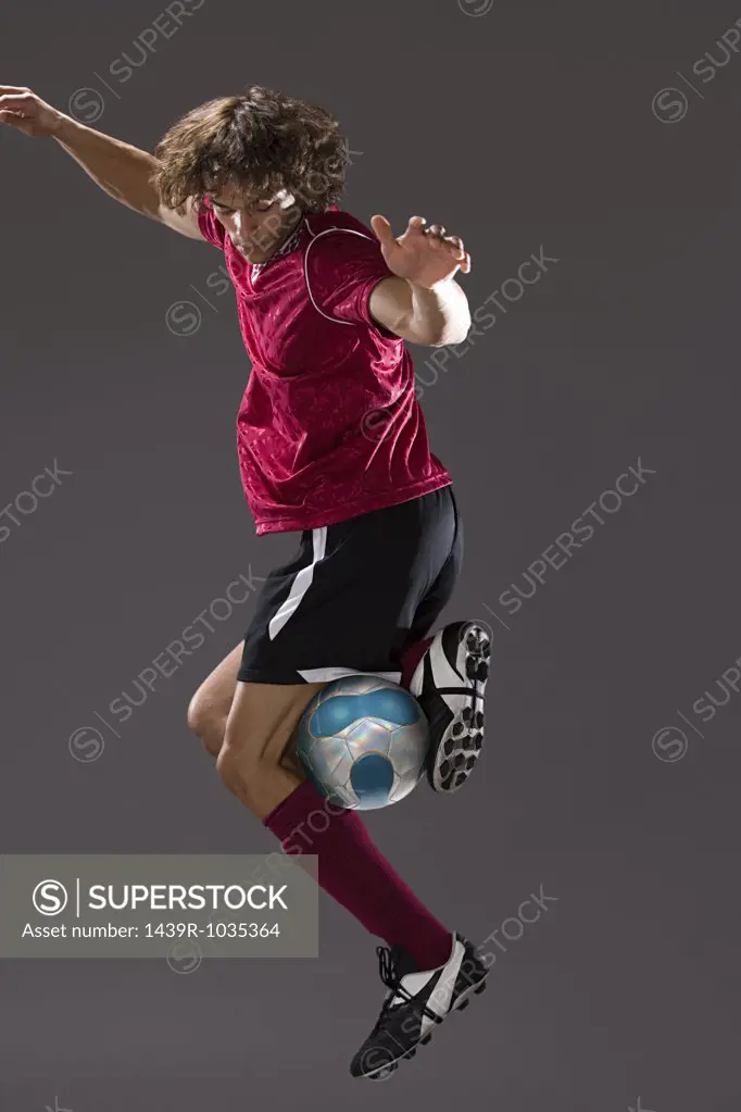 Footballer playing with ball