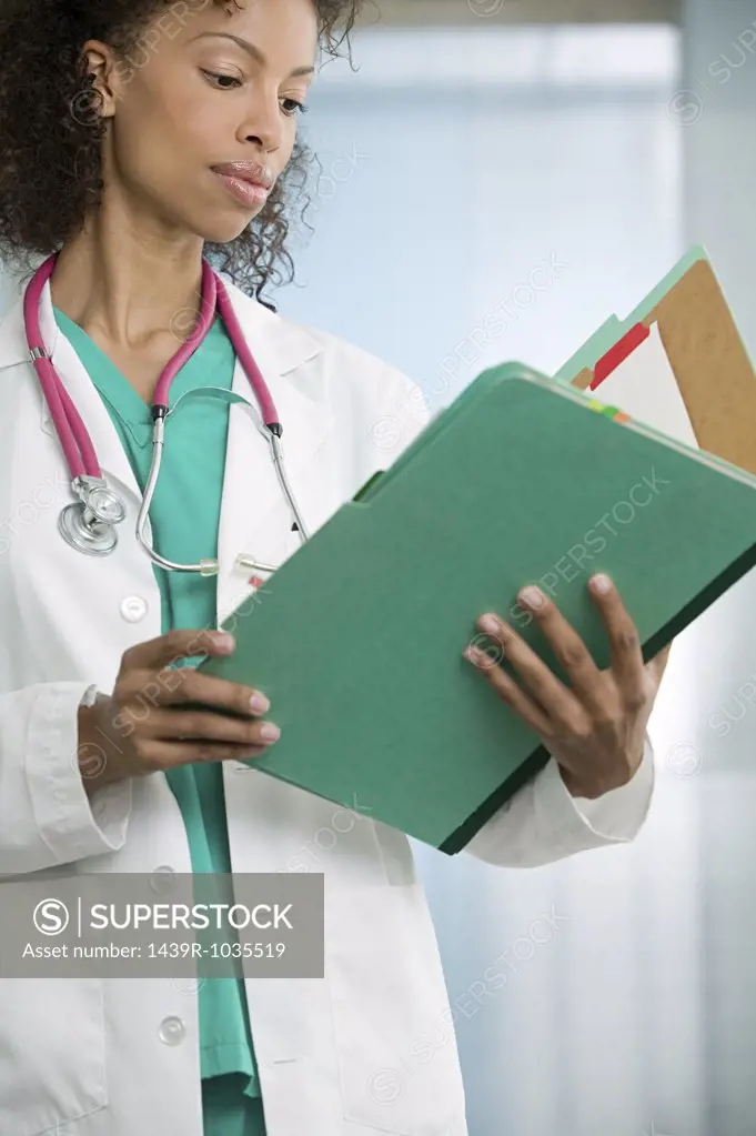 Doctor looking in file