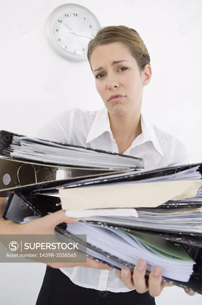 Woman struggling with files