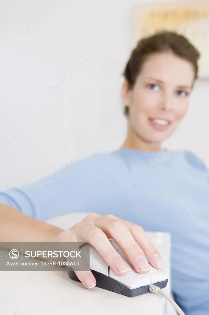 Woman using computer mouse