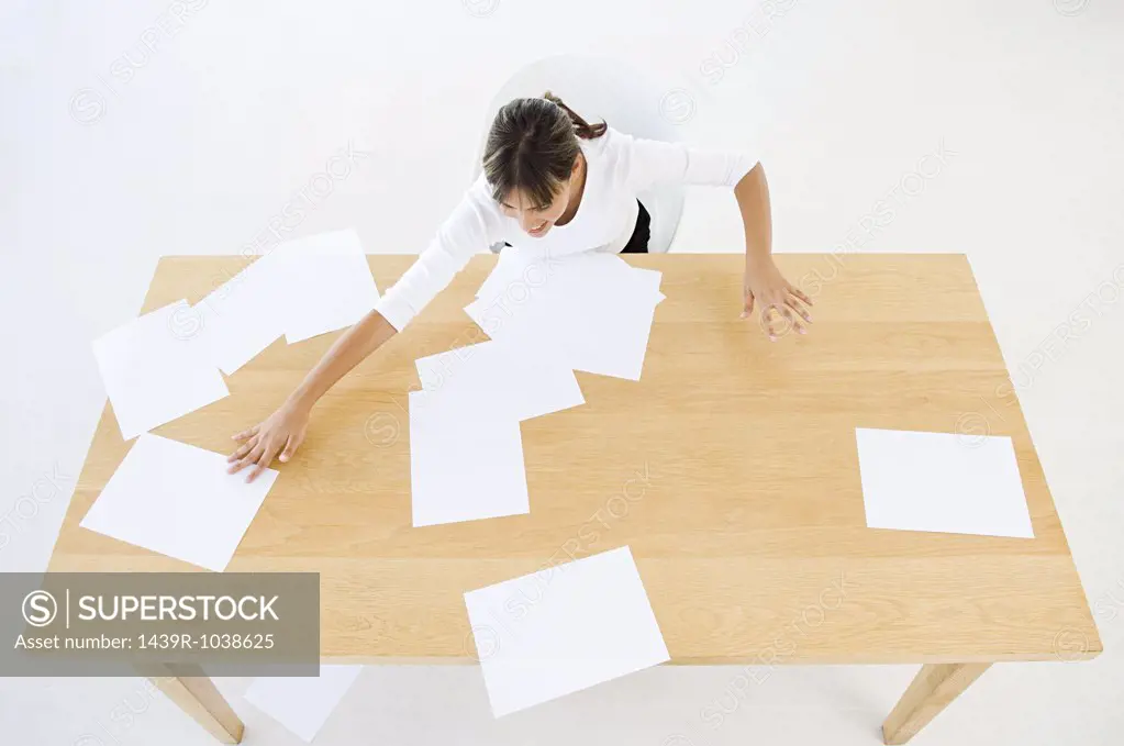 Woman sorting paper work