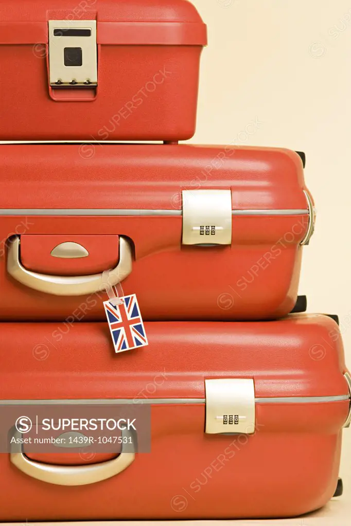 Stack of suitcases with british flag tag