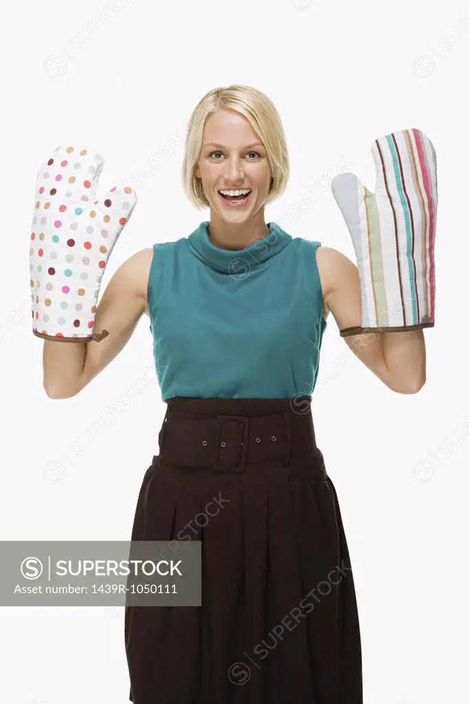 Woman wearing oven gloves