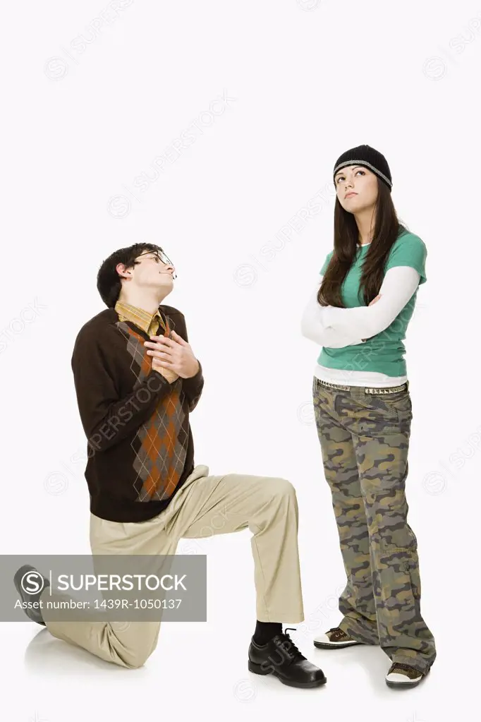 Boy pleading with girl