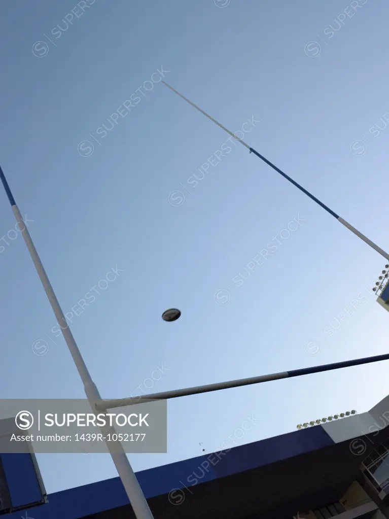 Rugby ball over a rugby post