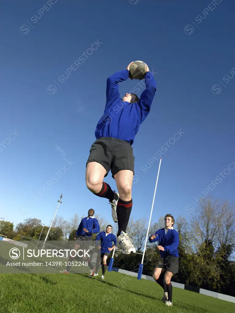 Rugby player catching ball