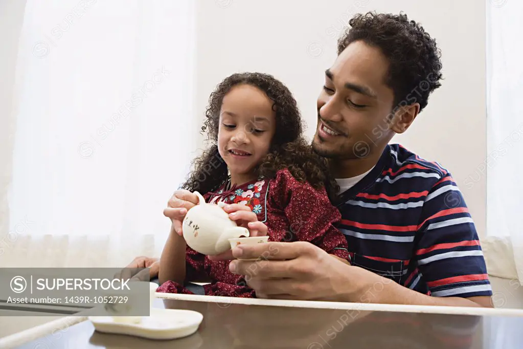 Father and daughter playing