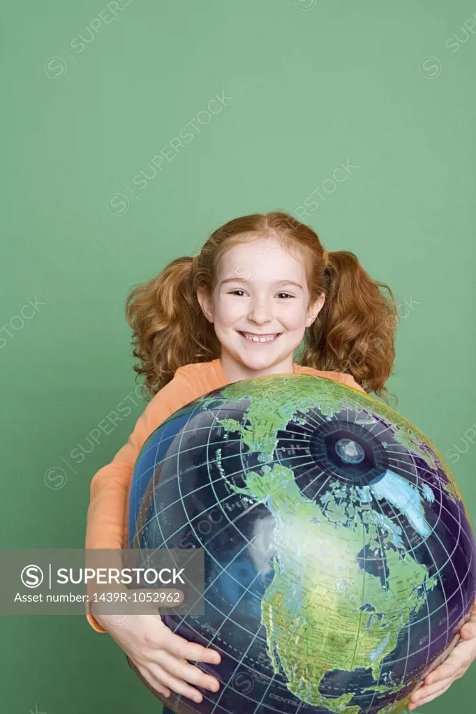 Girl holding a globe