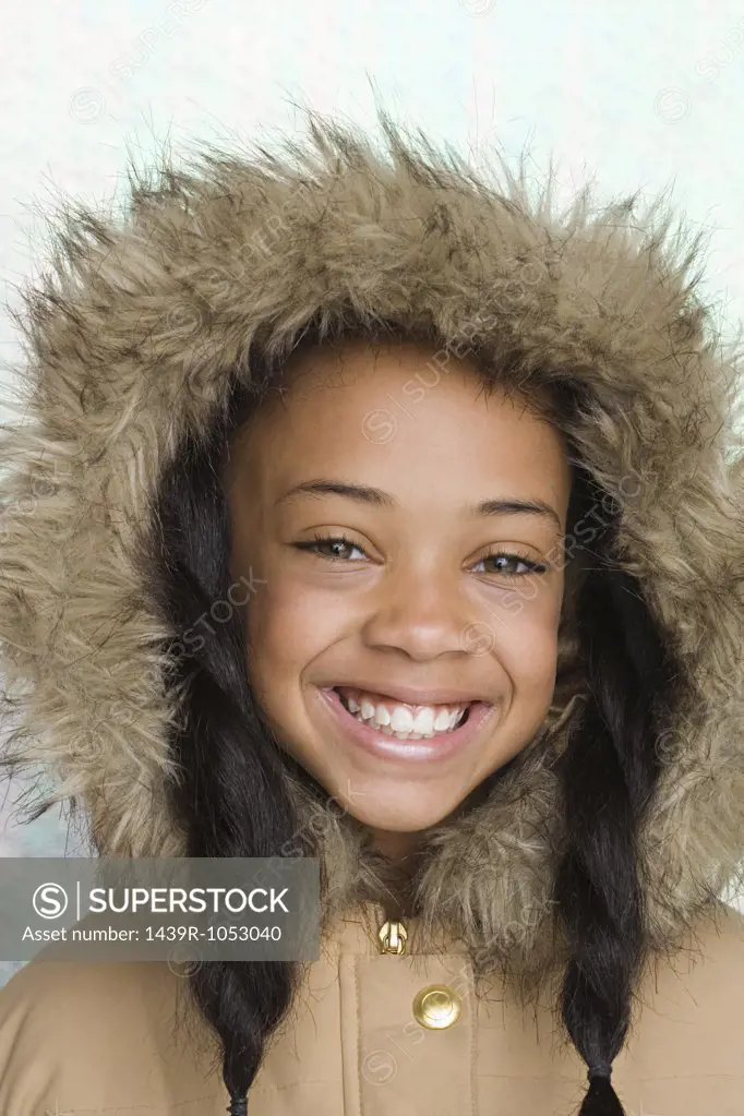 Girl wearing coat with furry hood