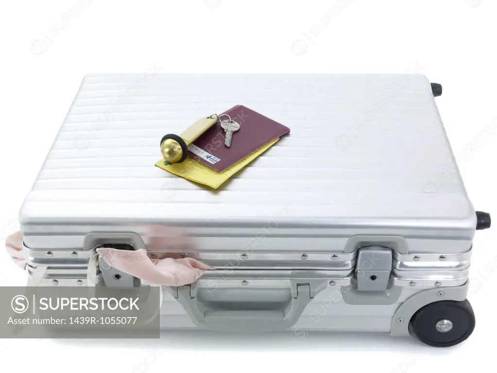 Suitcase passport and hotel key