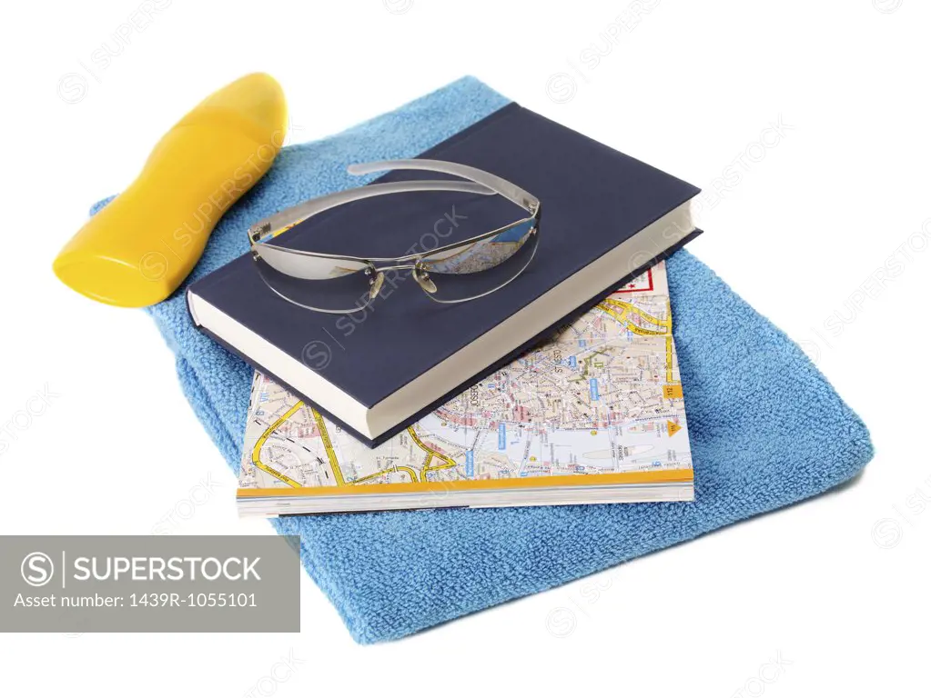 Book map and beach towel