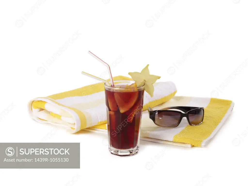 Cocktail sunglasses and beach towel