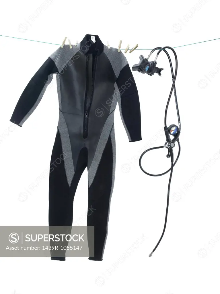 Wet suit and diving equipment on washing line