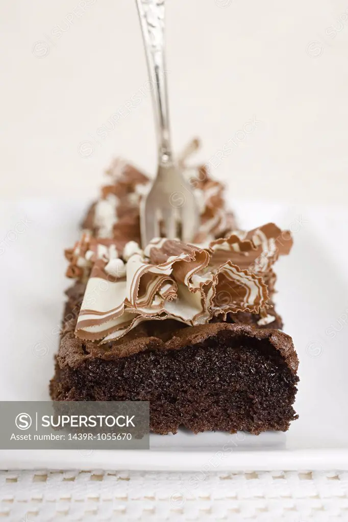 A fork in a chocolate cake