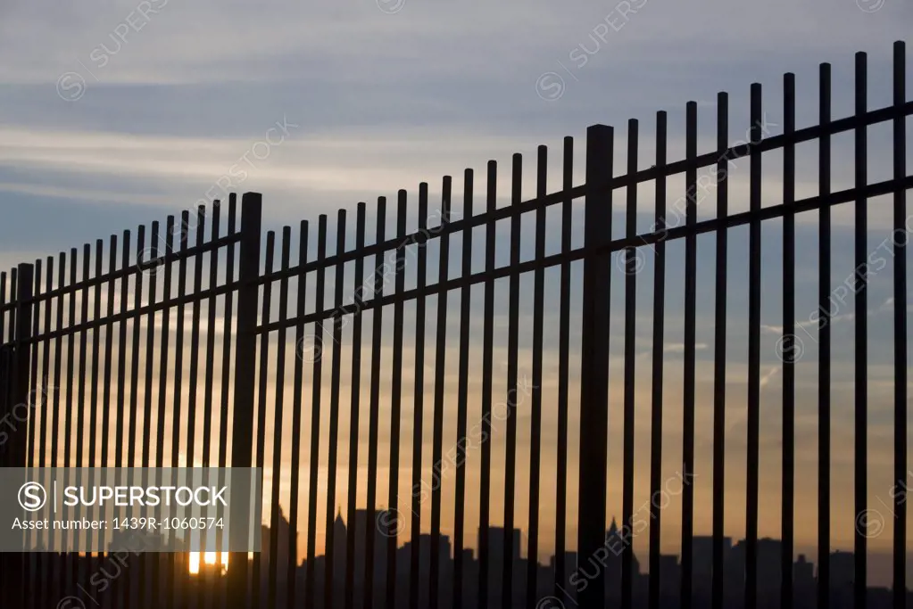New york skyline through a fence
