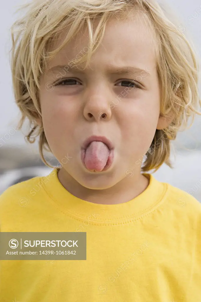 Boy sticking out tongue