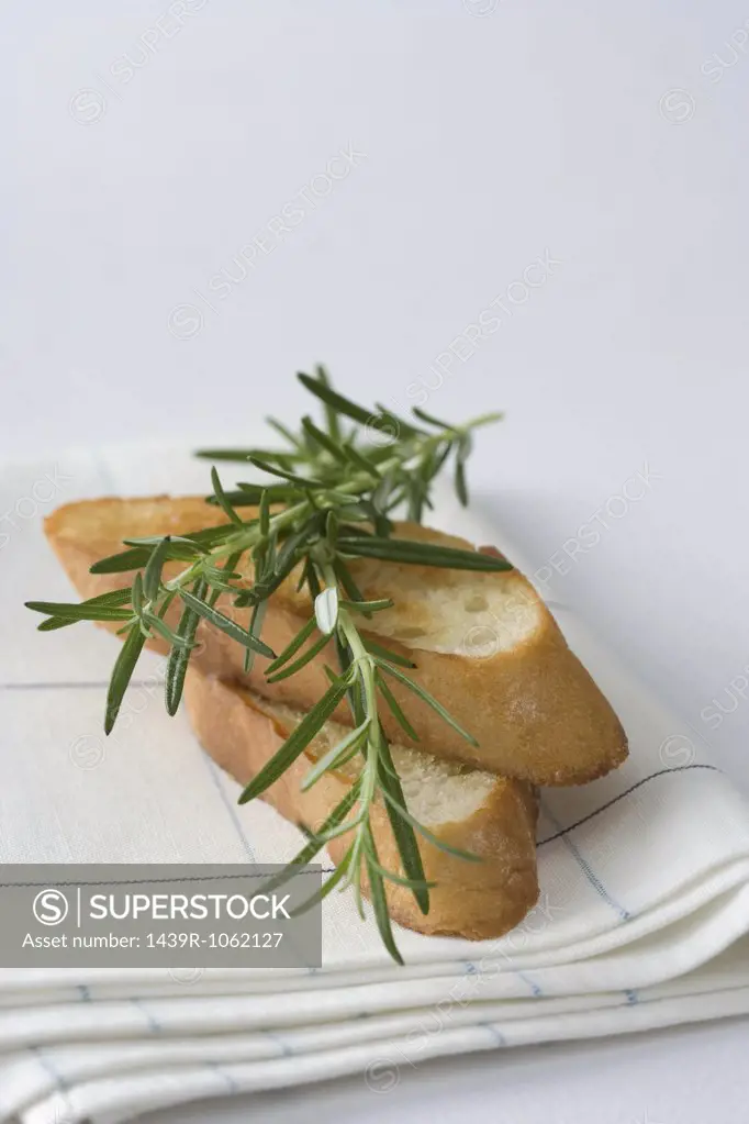 Rosemary on top of toasted bread