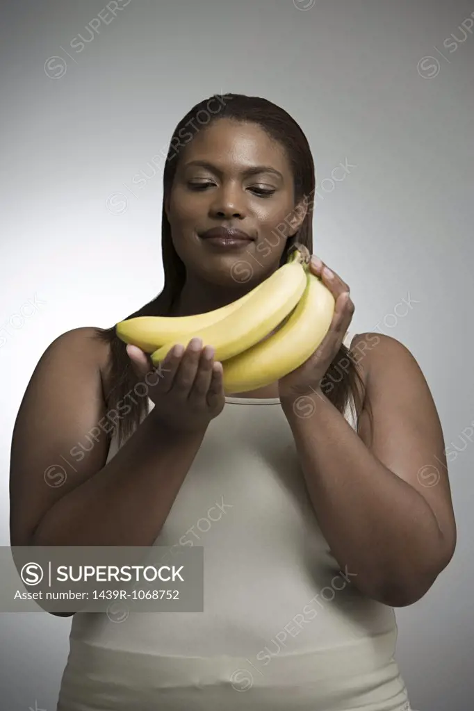 Woman holding bananas