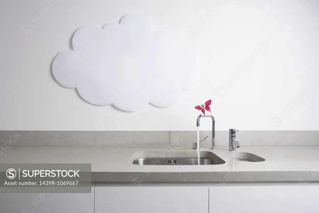 A cloud and a butterfly on a tap
