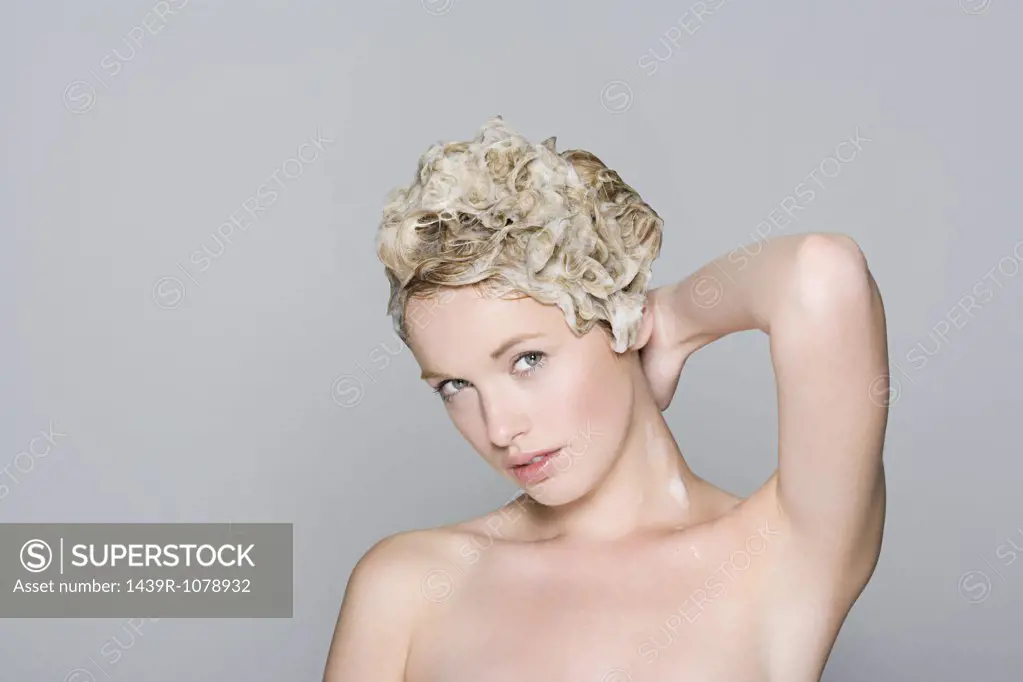 Portrait of a woman with shampoo in her hair