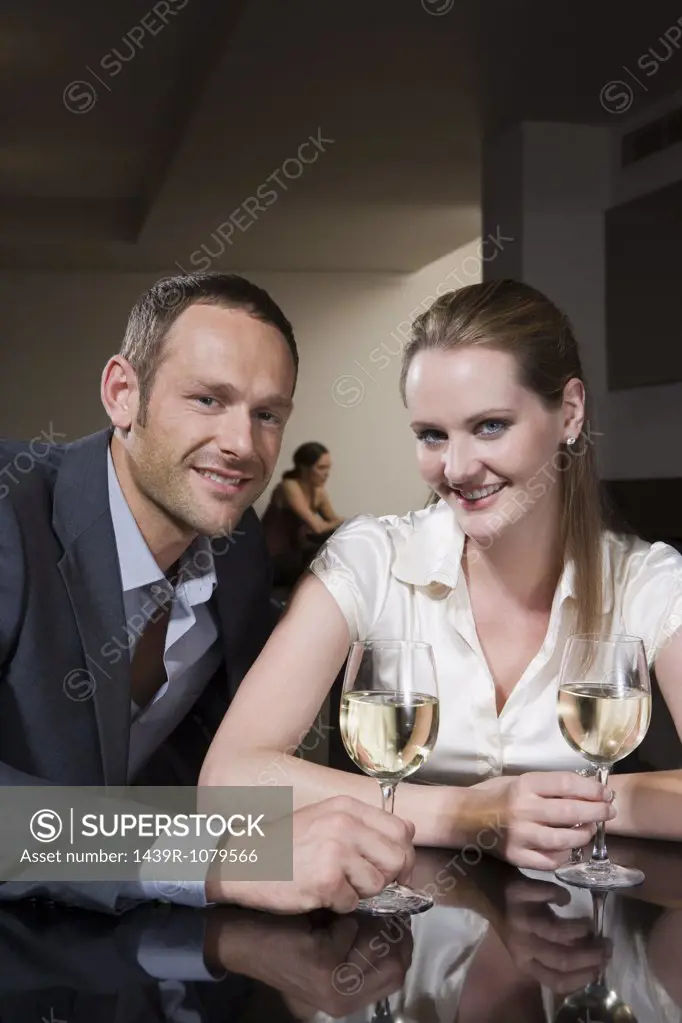 Couple drinking wine in a bar