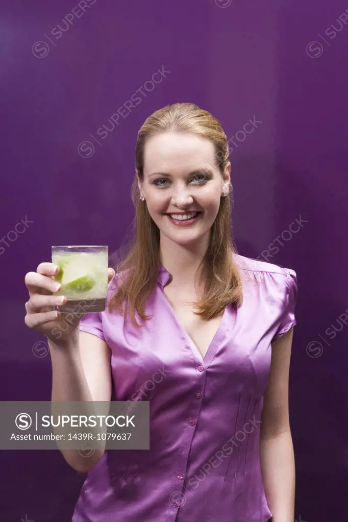 Woman holding a cocktail