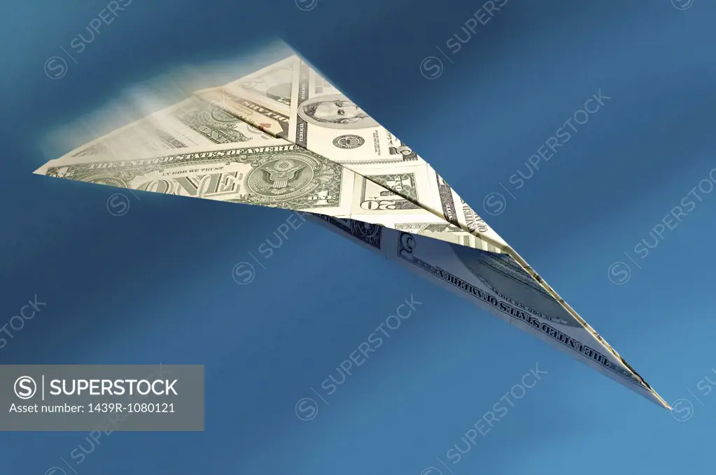 Paper aeroplane made of dollars