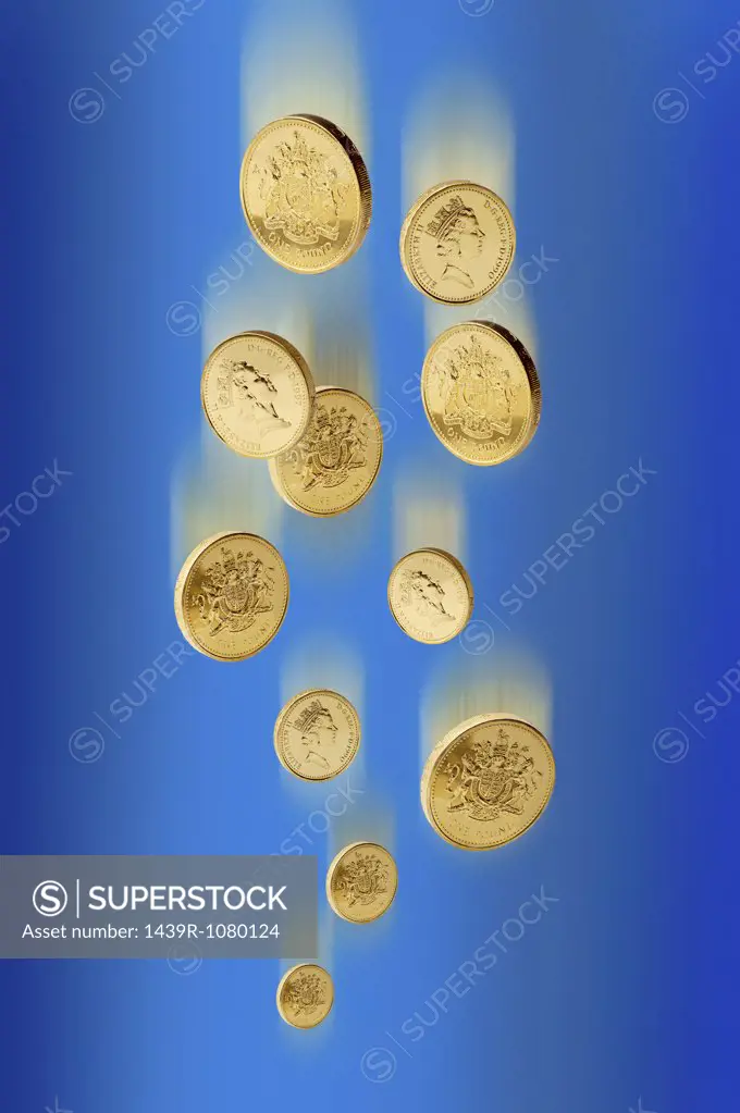 One pound coins falling