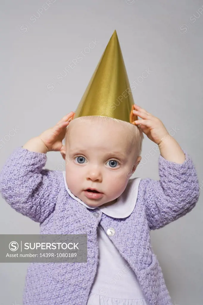 Baby with a party hat