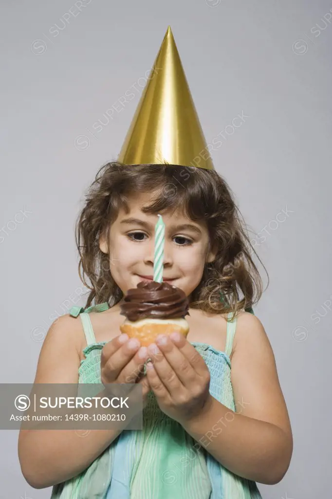 Girl with birthday cupcake