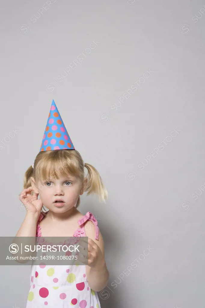 Girl wearing a party hat