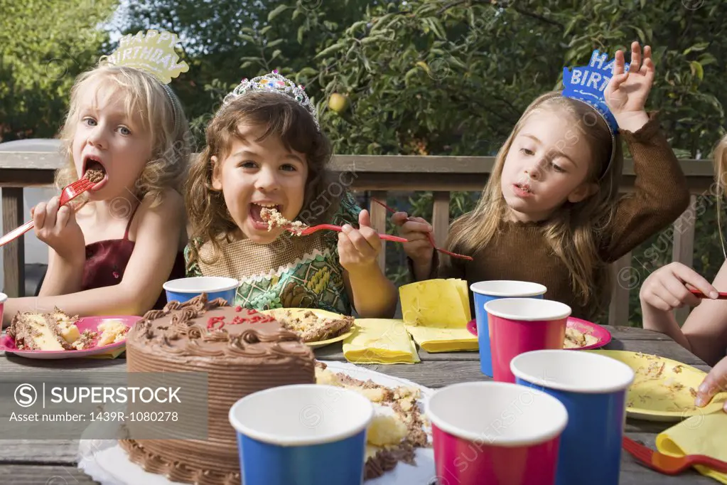 Girls eating birthday cake