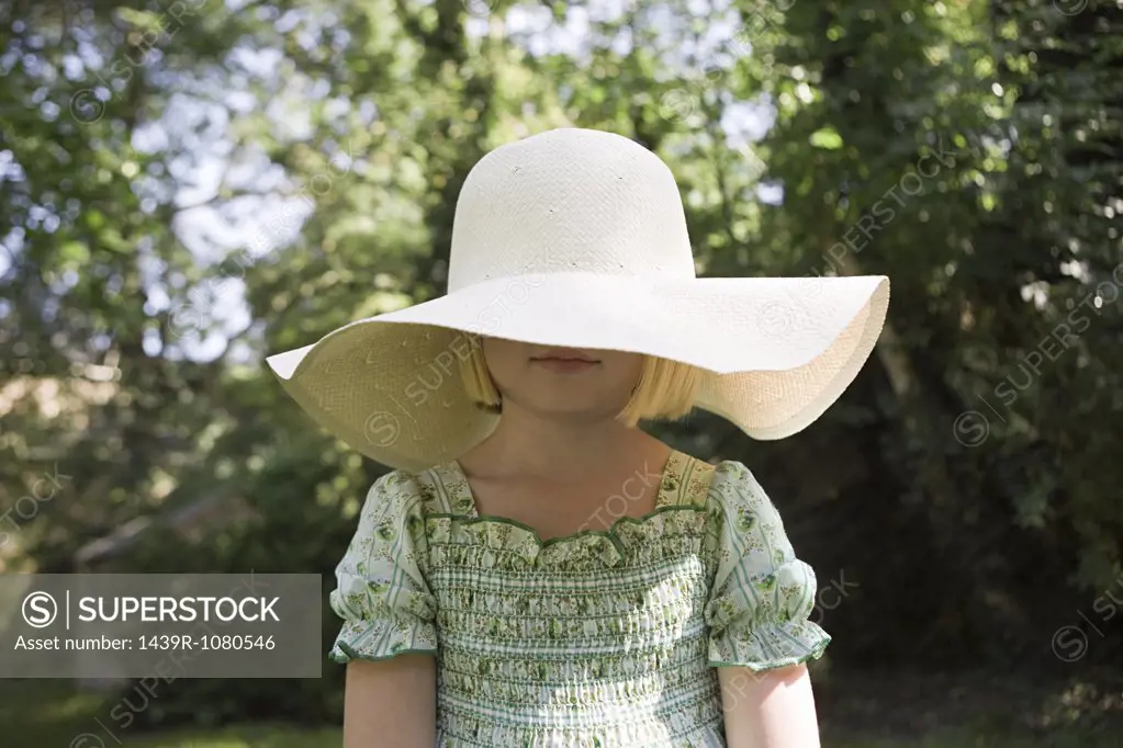 Girl wearing a large sun hat