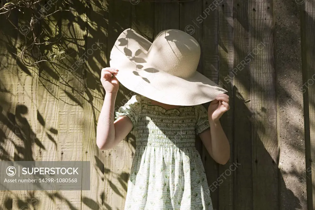 Girl wearing a sun hat
