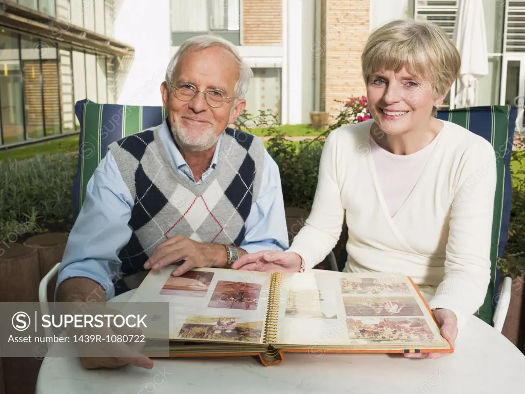 Senior couple looking at a photo album