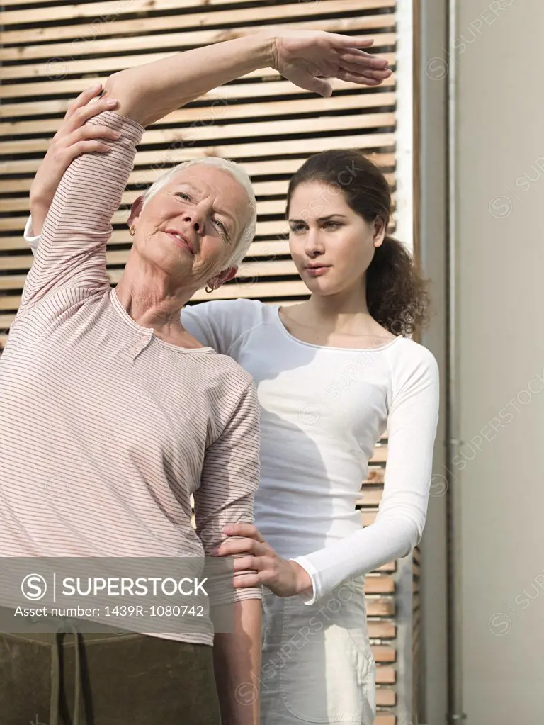 Senior woman receiving physiotherapy