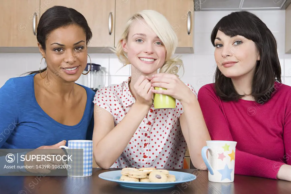 Three female friends in kitchen