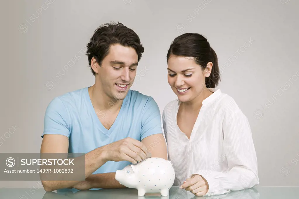 Couple with piggy bank