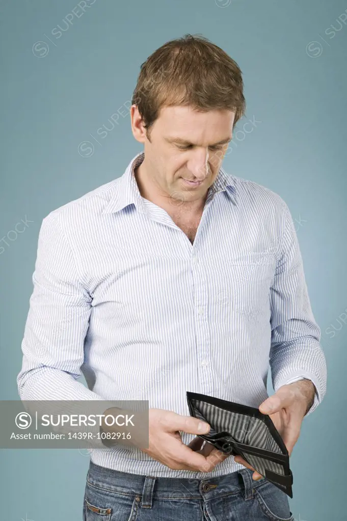 Man looking in wallet