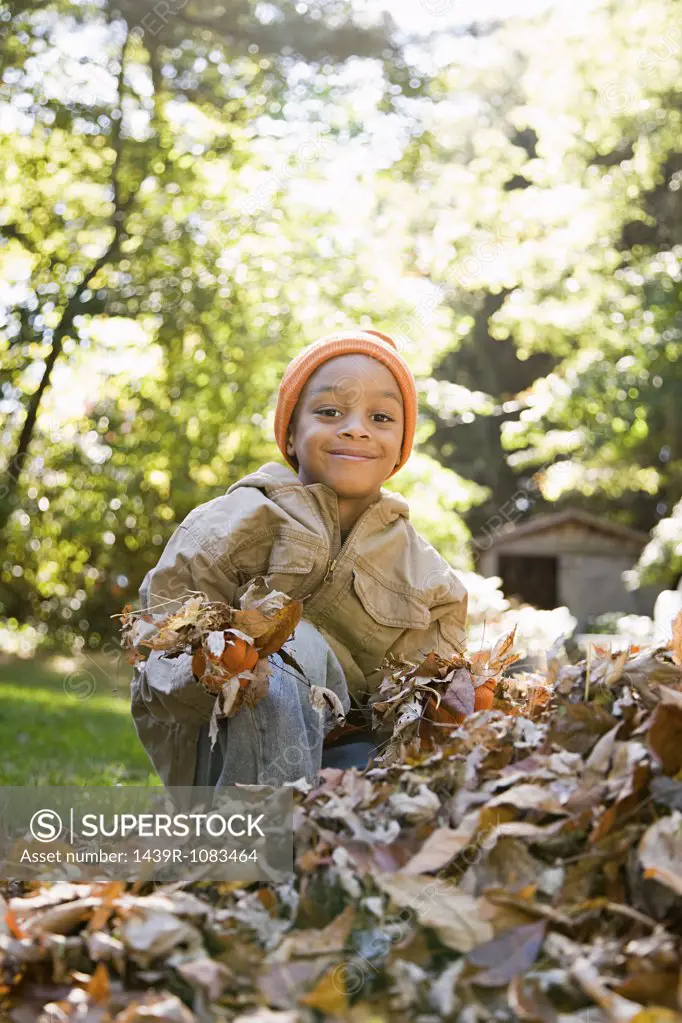 Boy holding leaves